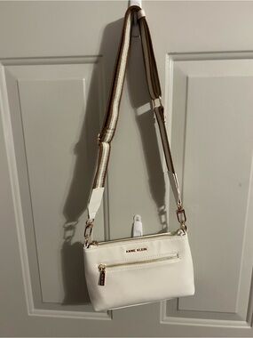 Anne Klein Creamy White Crossbody with Striped Brown and White Strap